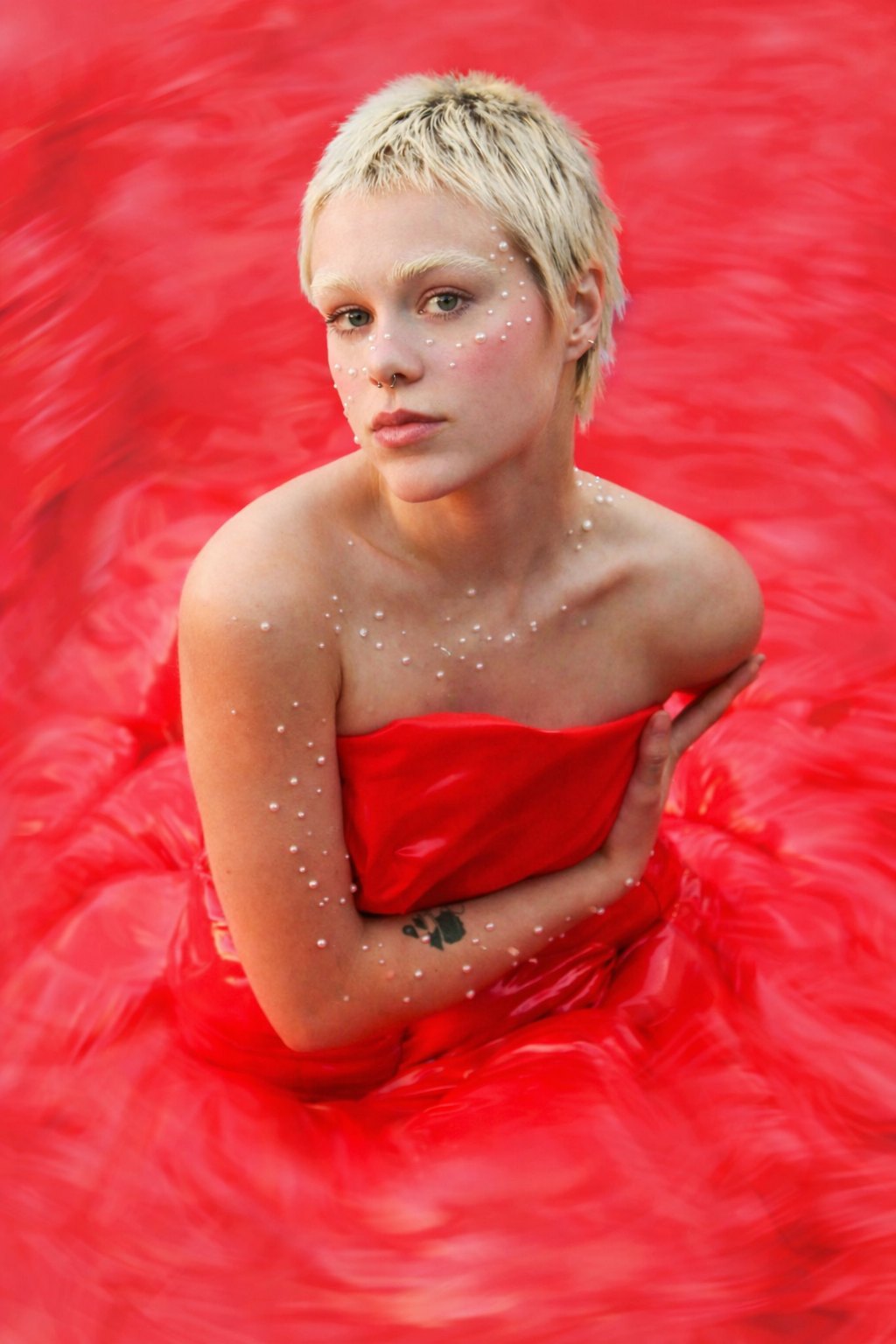 Figure in red water wearing a red bodice, Strike Magazine editorial