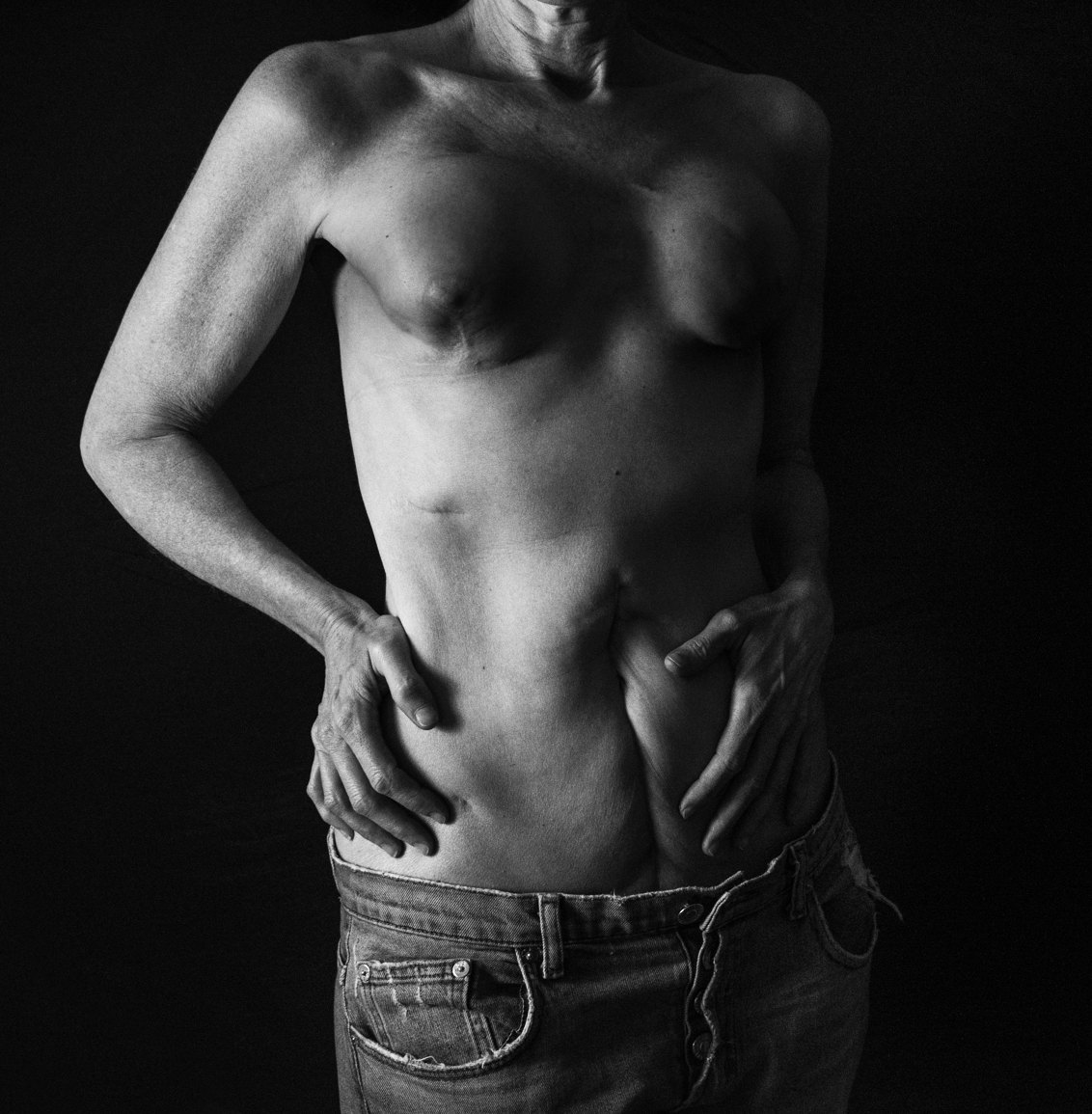 Black and white photograph, torso and hands