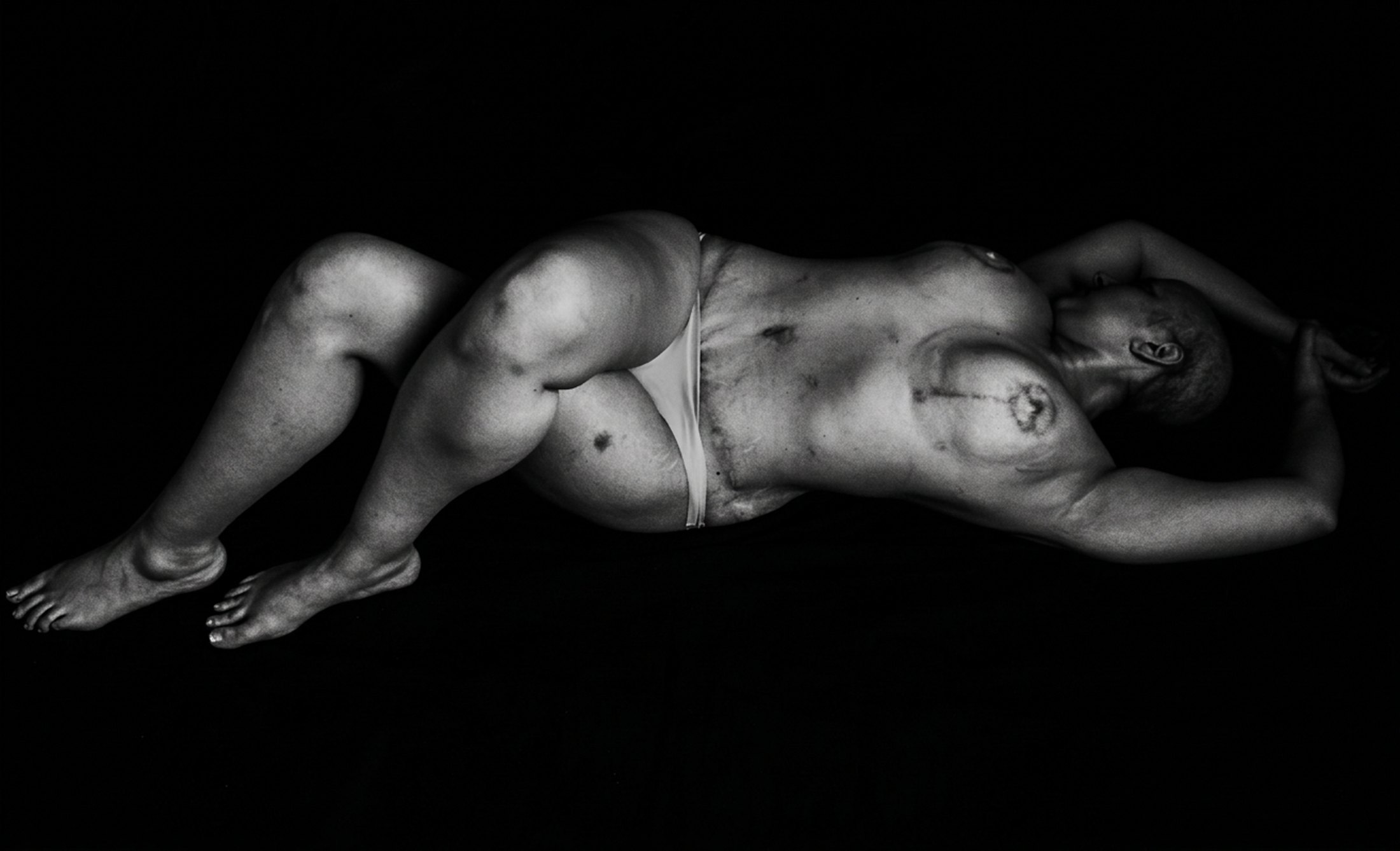 Black and white photograph, reclining figure